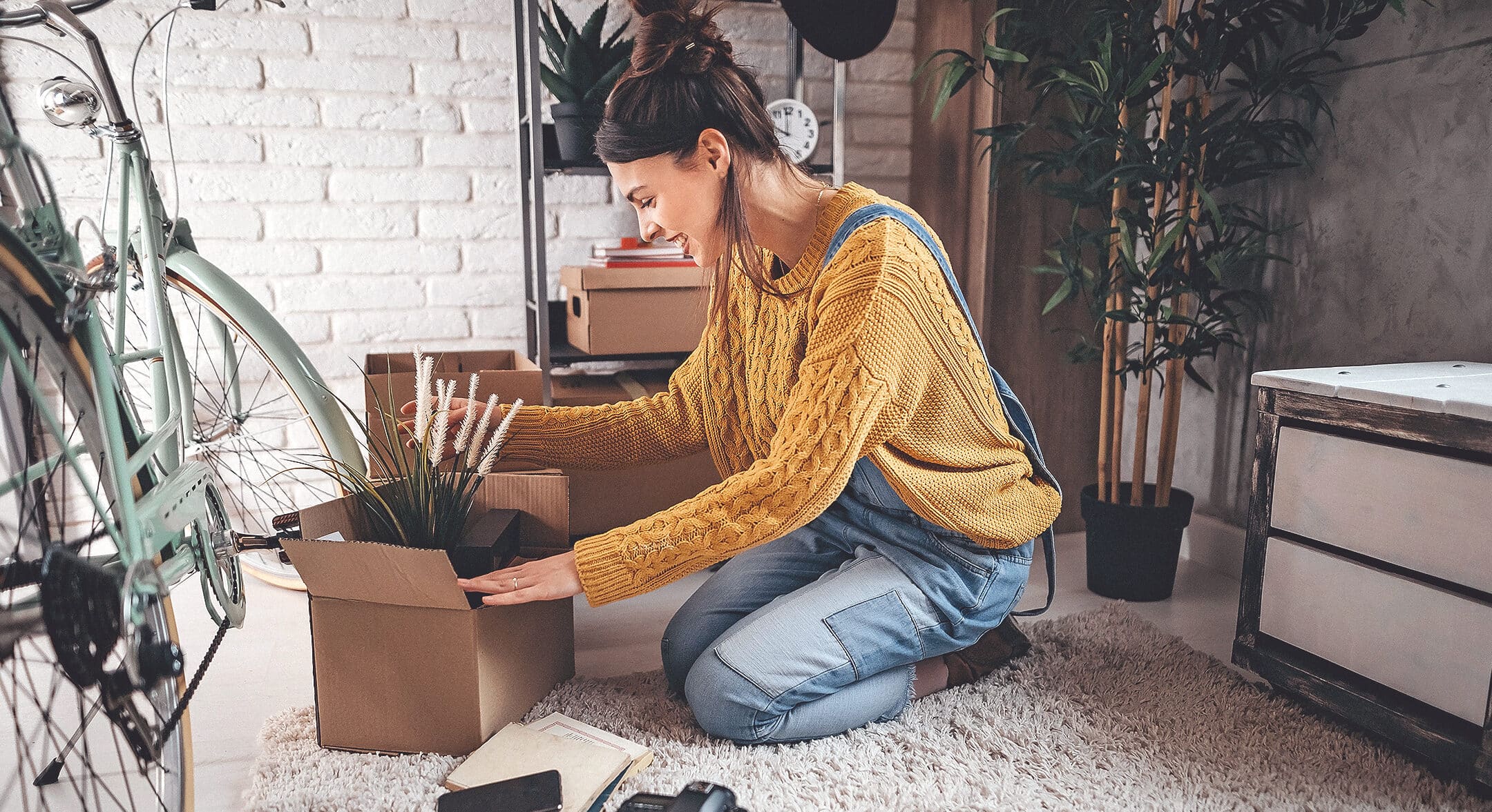 A Woman packing up her belongings before moving into her new home.